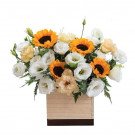 Wooden box of sunflowers and eustoma flowers.