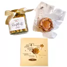 Gift set with jar of roasted nuts, vacuum-sealed dried lotus, and a golden box with lotus design.