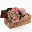 Bouquet of pink roses and carnations on a cardboard box from POTICO.VN.