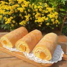 Three golden egg floss rolls with cheese filling on a wooden board.