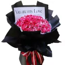 Bouquet of variegated pink and white roses in black paper with "You are my Love" card and red/white ribbon.