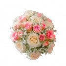 Bridal bouquet with cream and pink roses, and baby's breath.