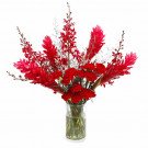 Red ginger flowers, red carnations, and orchids in a glass vase.