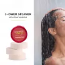 Shower steamers with "Full of Love" label stacked on white bath bombs.