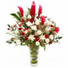 Large floral arrangement with red ginger, white chrysanthemums, and red gerbera daisies in a glass vase.