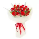 A bouquet of 18 red roses, wrapped in white paper and tied with a red ribbon.