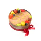 Chocolate mousse cake with fresh fruit and a red ribbon, decorated with "All the best on your special day."