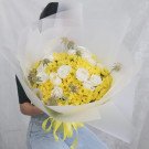 Yellow daisy and white rose bouquet with scabiosa flowers.