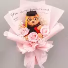 Graduation bear bouquet with pink roses and baby's breath.