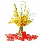 Yellow gladiolus and orchids in a vase with red envelopes, symbolizing luck.