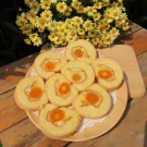 Slices of fluffy egg floss roll cake with salted egg yolk and cheese filling.