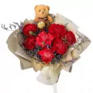 Red carnation bouquet with mini teddy bear and Ferrero Rocher chocolate.
