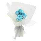 A bouquet of 4 blue roses wrapped in white mesh and tied with a grey ribbon.