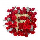 Red and white roses arranged in the shape of letters.