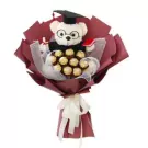 Graduation teddy bear bouquet with Ferrero Rocher chocolates, red and white wrapping.