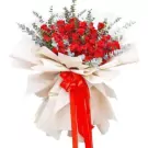 Bouquet of 150 red roses with eucalyptus and white paper wrapping, tied with a red ribbon.