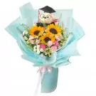 Graduation bouquet with sunflowers, pink carnations, daisies, and a graduation teddy bear.
