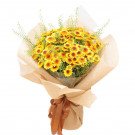 Bouquet of yellow and orange chrysanthemums with brown paper and ribbon.