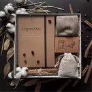 Espressiano gift set with notebook, socks, soap, and burlap bag.