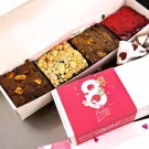 Box of assorted brownies: chocolate nut, crumble, swirled, and red topped.