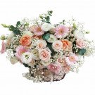 Basket of peach and pink roses, white lisianthus, and pink gerbera daisies with baby's breath.