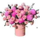 Pink roses and hot pink chrysanthemums in a pink box.