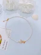 Pearl necklace with butterfly charm 2