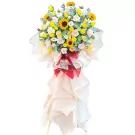 Grand opening flower stand with sunflowers, roses, and other flowers.