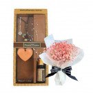 Aromatherapy gift set with heart-shaped scented stone, essential oil, and dried flowers.