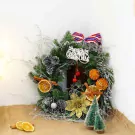 Christmas wreath with pinecones, dried oranges, cinnamon, and gold flower.