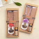 Gift set with dried flowers, aroma stone, and essential oil bottles.