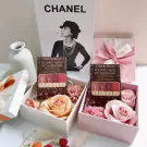 Charlotte Tilbury Iconic Mini Lip Wardrobe lipstick set in gift boxes with flowers.
