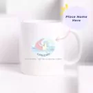 White ceramic mug with a Capricorn zodiac design and a pink crescent moon.
