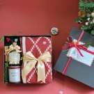 Christmas gift set: red scarf, Berry Bliss candle, matches in a box.
