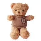 Brown teddy bear wearing a knitted sweater with a crest on it.