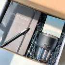 Impresso Americano gift set with notebook, pen, tumbler, and straw.