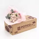 A pastel bouquet of roses, hydrangeas, and carnations in a box from POTICO.VN