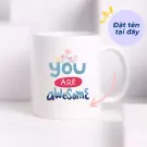 White ceramic mug with "you ARE awesome" text and small flowers design.