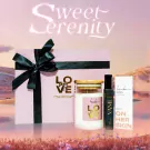 Pink gift box with candle, perfume, and lotion, text says "Sweet Serenity".