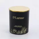 Black scented candle with gold lid and floral accents, "D'Larose" label.