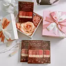Charlotte Tilbury lipstick sets with roses, gift boxes, and ribbon.