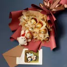 Chocolate Ferrero bouquet with a mini teddy bear and a card.