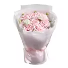 Bouquet of pale pink roses with delicate white filler flowers, wrapped in white and pink paper, tied with a pink ribbon.