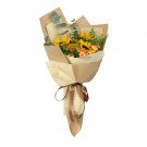 Bouquet of sunflowers, carnations, and eucalyptus, wrapped in brown and cream paper with a brown ribbon.