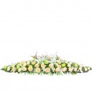 A long, low floral arrangement with white lilies, peach roses, and green filler flowers.