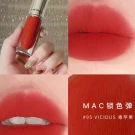 MAC 95 Vicious liquid lipstick in red-orange, shown in a tube and on lips.