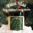 Frosted Pine Glow Candle with "My Christmas Tree" label, set against a festive Christmas tree background.