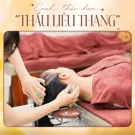 Hands massaging a person's head with herbal hair wash.