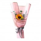 A single sunflower bouquet wrapped in pink paper and tied with a gray ribbon.