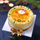 Christmas mousse cake with Santa, snowflakes, and festive decorations.